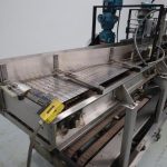 Hartness Model 825 Auto 35 CPM S/S Drop Case Packer For Round Containers