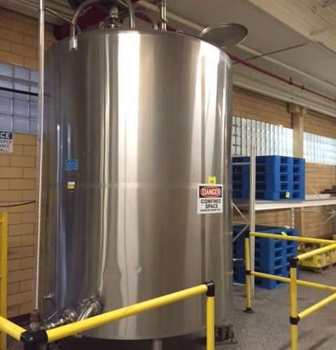 1,500 Gallon DCI S/S Vertical Jacketed Off-Center Turbine Agitated Slope Bottom Tank