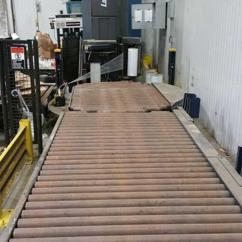 Lantech Model Q600 Pallet Stretch Wrapper with Roller Conveyor Infeed and Discharge