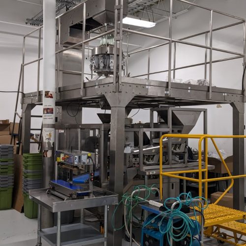 Excel Rotary Premade Pouch Filling and Sealing System with Pouch Filler, Combination Scale, and Bucket Elevator